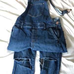 Ripped knee overalls